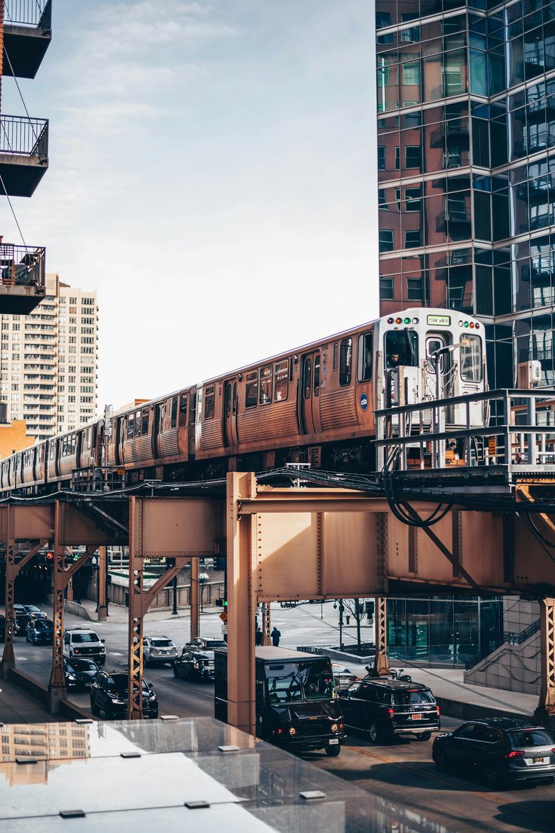 A Chicago L train on elevated tracks above the street