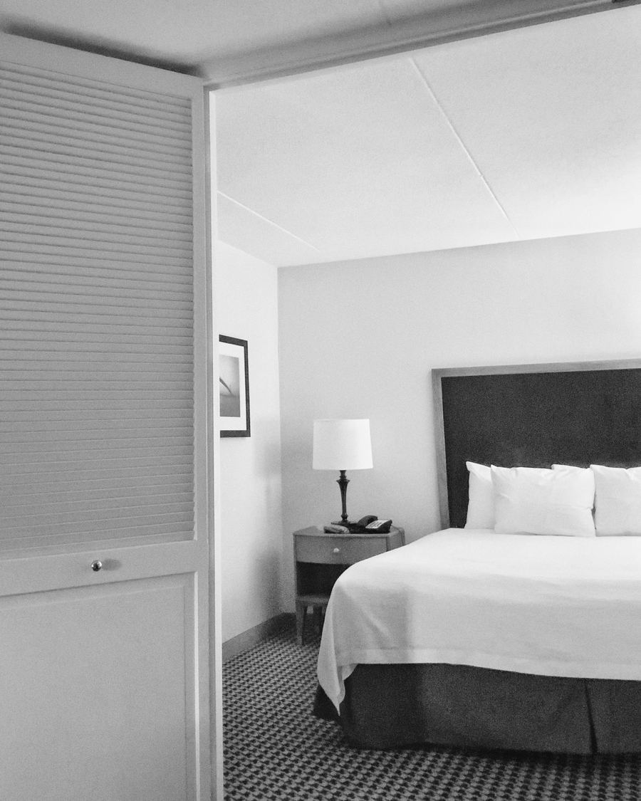 A made bed with crisp white linen